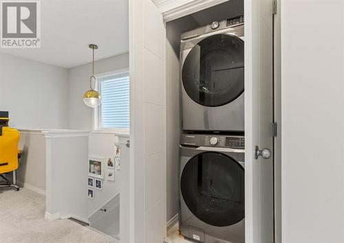 Upper Level Laundry - 138 Midgrove Greenway Sw, Airdrie, AB - Indoor Photo Showing Laundry Room