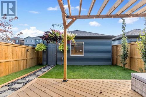 Professionally Landscaped - 138 Midgrove Greenway Sw, Airdrie, AB - Outdoor With Deck Patio Veranda