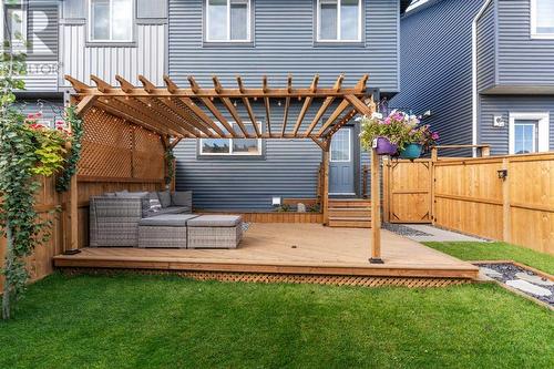 Professionally Landscaped - 138 Midgrove Greenway Sw, Airdrie, AB - Outdoor With Deck Patio Veranda With Exterior