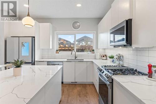 138 Midgrove Greenway Sw, Airdrie, AB - Indoor Photo Showing Kitchen With Upgraded Kitchen