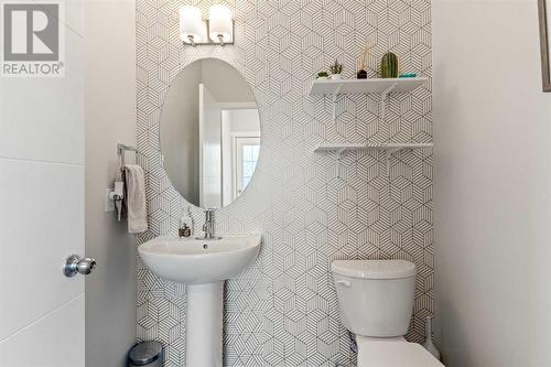 Main Floor Powder Room - 138 Midgrove Greenway Sw, Airdrie, AB - Indoor Photo Showing Bathroom