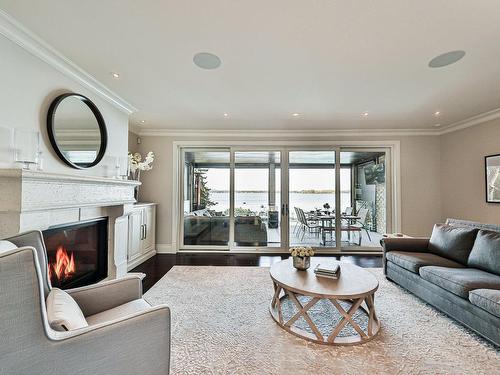 Living room - 18 Tsse Pagé, Montréal (L'Île-Bizard/Sainte-Geneviève), QC - Indoor Photo Showing Living Room With Fireplace