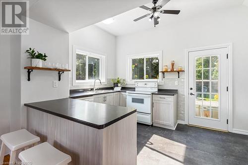 Walk out to the deck from the kitchen - 341 23Rd Street W, Owen Sound, ON - Indoor Photo Showing Kitchen