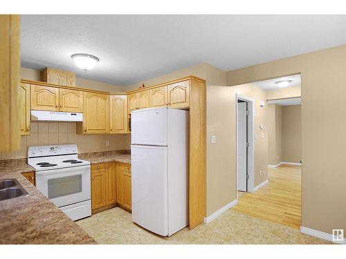 #2 12807 127 St Nw, Edmonton, AB - Indoor Photo Showing Kitchen With Double Sink