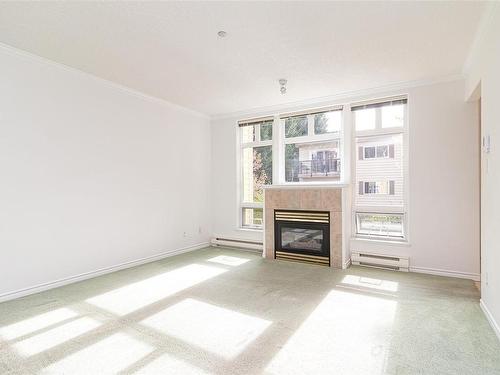 204-1663 Mckenzie Ave, Saanich, BC - Indoor Photo Showing Living Room With Fireplace