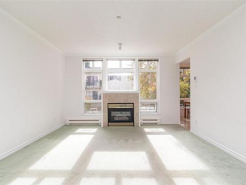 204-1663 Mckenzie Ave, Saanich, BC - Indoor Photo Showing Living Room With Fireplace