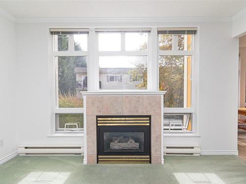 204-1663 Mckenzie Ave, Saanich, BC - Indoor Photo Showing Living Room With Fireplace