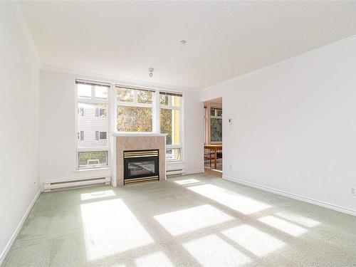 204-1663 Mckenzie Ave, Saanich, BC - Indoor Photo Showing Living Room With Fireplace