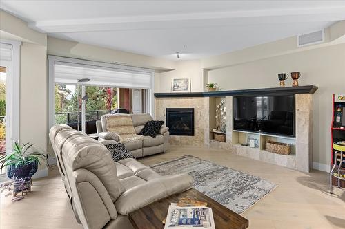 204-3865 Truswell Road, Kelowna, BC - Indoor Photo Showing Living Room With Fireplace