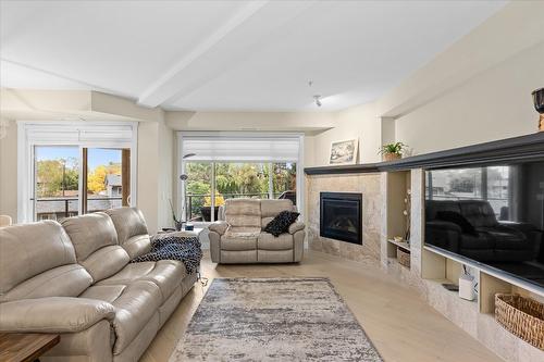 204-3865 Truswell Road, Kelowna, BC - Indoor Photo Showing Living Room With Fireplace