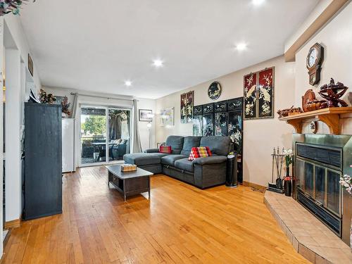 Salon - 1701 36E Avenue, Montréal (Rivière-Des-Prairies/Pointe-Aux-Trembles), QC - Indoor Photo Showing Other Room With Fireplace