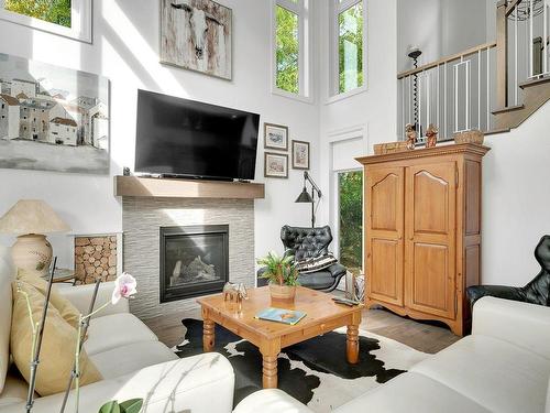 Salon - 27 Place St-Michel, Saint-Sauveur, QC - Indoor Photo Showing Living Room With Fireplace