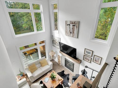 Salon - 27 Place St-Michel, Saint-Sauveur, QC - Indoor Photo Showing Living Room With Fireplace