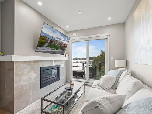 308-1820 Maple Ave South, Sooke, BC - Indoor Photo Showing Living Room With Fireplace