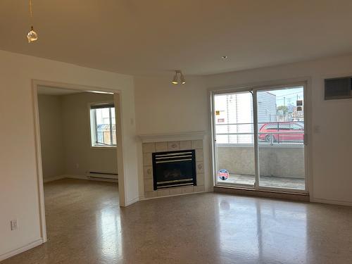 102-2401 South Main Street, Penticton, BC - Indoor Photo Showing Living Room With Fireplace