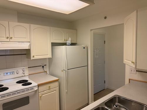 102-2401 South Main Street, Penticton, BC - Indoor Photo Showing Kitchen With Double Sink