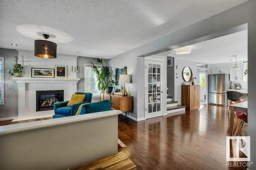 7637 Schmid Cr Nw, Edmonton, AB - Indoor Photo Showing Living Room With Fireplace