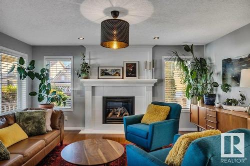 7637 Schmid Cr Nw, Edmonton, AB - Indoor Photo Showing Living Room With Fireplace