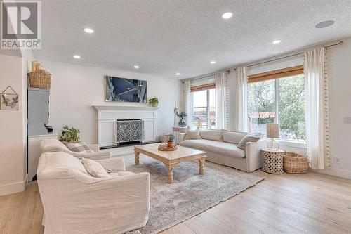 41 Strathlea Court Sw, Calgary, AB - Indoor Photo Showing Living Room With Fireplace