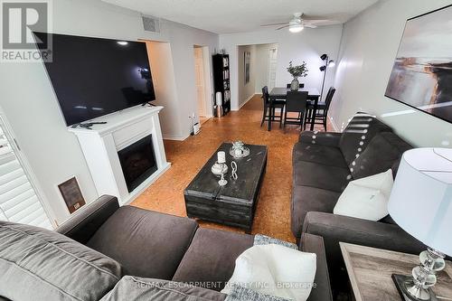 108 - 1225 North Shore Boulevard, Burlington, ON - Indoor Photo Showing Living Room With Fireplace