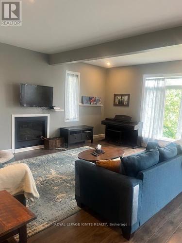 1455 Berkshire Drive, Kingston, ON - Indoor Photo Showing Living Room With Fireplace