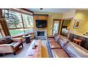 4559 Timberline  Crescent Unit# 612C, Fernie, BC  - Indoor Photo Showing Living Room With Fireplace 