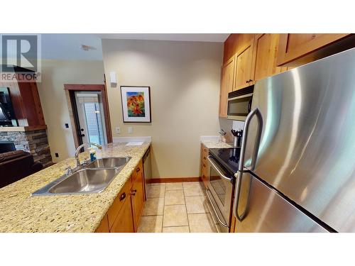 4559 Timberline  Crescent Unit# 612C, Fernie, BC - Indoor Photo Showing Kitchen With Stainless Steel Kitchen With Double Sink