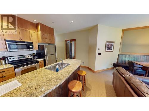 4559 Timberline  Crescent Unit# 612C, Fernie, BC - Indoor Photo Showing Kitchen With Stainless Steel Kitchen With Double Sink