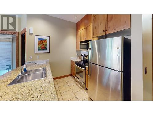 4559 Timberline  Crescent Unit# 612C, Fernie, BC - Indoor Photo Showing Kitchen With Stainless Steel Kitchen With Double Sink