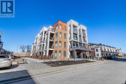 101 - 120 Canon Jackson Drive, Toronto, ON - Outdoor With Facade