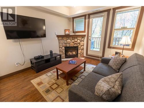 1500 Mcdonald  Avenue Unit# 122, Fernie, BC - Indoor Photo Showing Living Room With Fireplace