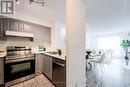 703 - 11 Lee Centre Drive, Toronto, ON  - Indoor Photo Showing Kitchen With Double Sink 