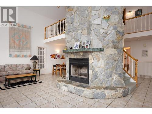 9611 Kilkenny Place, Fintry, BC - Indoor Photo Showing Living Room With Fireplace