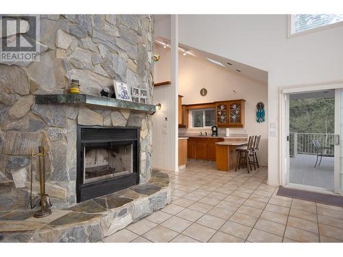 9611 Kilkenny Place, Fintry, BC - Indoor Photo Showing Living Room With Fireplace