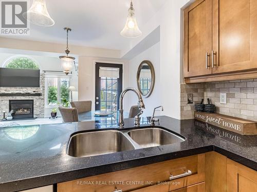 14 Standish Street, Halton Hills, ON - Indoor Photo Showing Kitchen With Fireplace With Double Sink