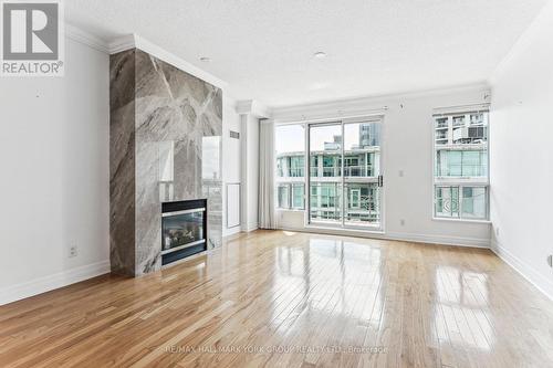 Ph304 - 88 Palace Pier Court, Toronto, ON - Indoor Photo Showing Living Room With Fireplace