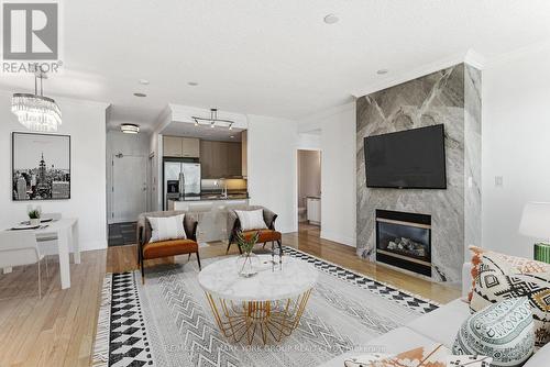 Ph304 - 88 Palace Pier Court, Toronto, ON - Indoor Photo Showing Living Room With Fireplace