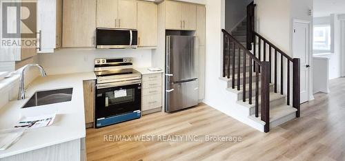 15 - 55 Tom Brown Drive, Brant, ON - Indoor Photo Showing Kitchen With Stainless Steel Kitchen