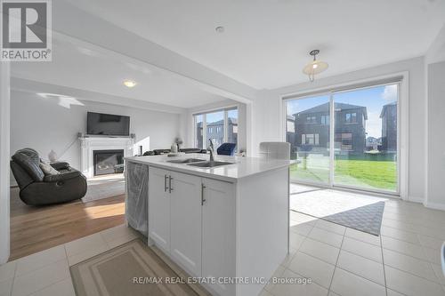 567 Bedi Drive W, Woodstock, ON - Indoor Photo Showing Kitchen With Fireplace With Double Sink