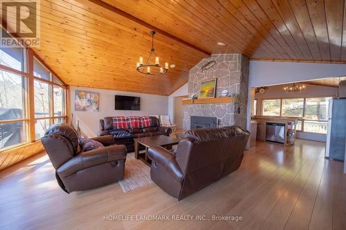 1245 Mortimers Point Road, Muskoka Lakes, ON - Indoor Photo Showing Living Room With Fireplace