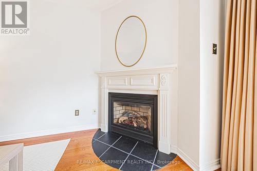 3 - 3333 New Street, Burlington, ON - Indoor Photo Showing Living Room With Fireplace