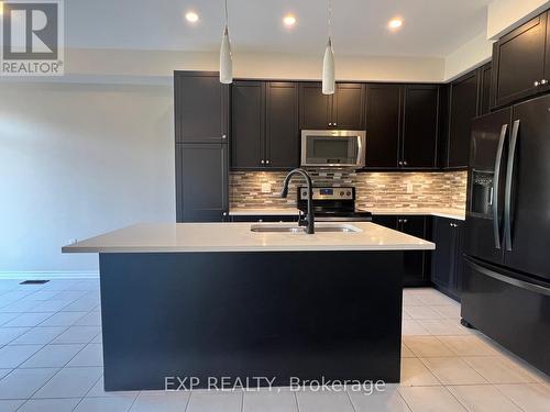 749 Elsley Court, Milton, ON - Indoor Photo Showing Kitchen With Double Sink With Upgraded Kitchen