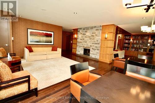 810 - 1055 Southdown Road, Mississauga, ON - Indoor Photo Showing Living Room With Fireplace