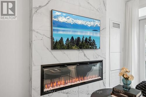 116 - 8228 Birchmount Road, Markham, ON - Indoor Photo Showing Living Room With Fireplace