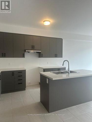 19 Prest Way, Centre Wellington, ON - Indoor Photo Showing Kitchen With Double Sink