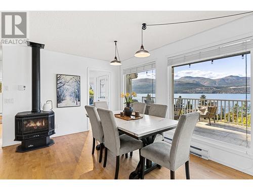 16639 Wentworth Road, Lake Country, BC - Indoor Photo Showing Dining Room With Fireplace