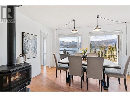 16639 Wentworth Road, Lake Country, BC - Indoor Photo Showing Dining Room With Fireplace