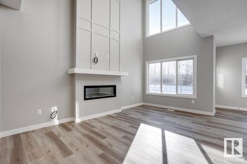 6255 175 Av Nw, Edmonton, AB - Indoor Photo Showing Living Room With Fireplace