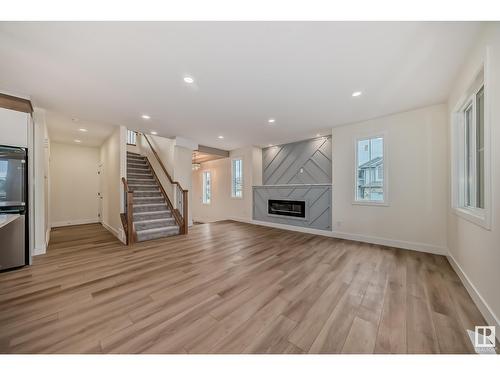 8387 Shaske Cr Nw, Edmonton, AB - Indoor Photo Showing Living Room With Fireplace