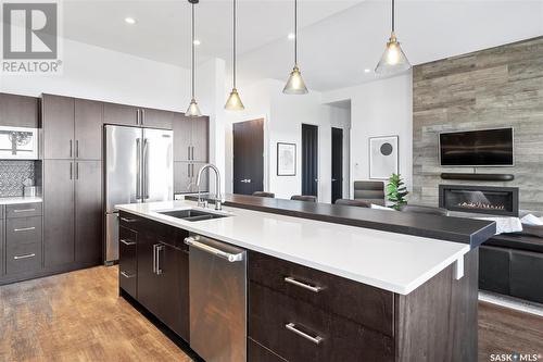 911 Hastings Crescent, Saskatoon, SK - Indoor Photo Showing Kitchen With Fireplace With Double Sink With Upgraded Kitchen